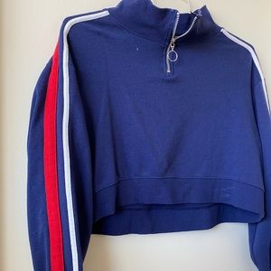 blue sweater with red and white stripes